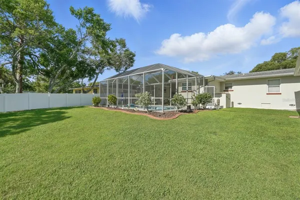 a view of a house with a back yard