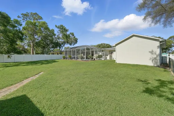 a view of a house with a big yard