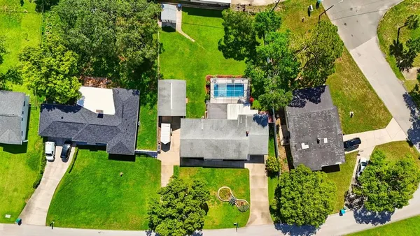 an aerial view of a house with a garden and plants