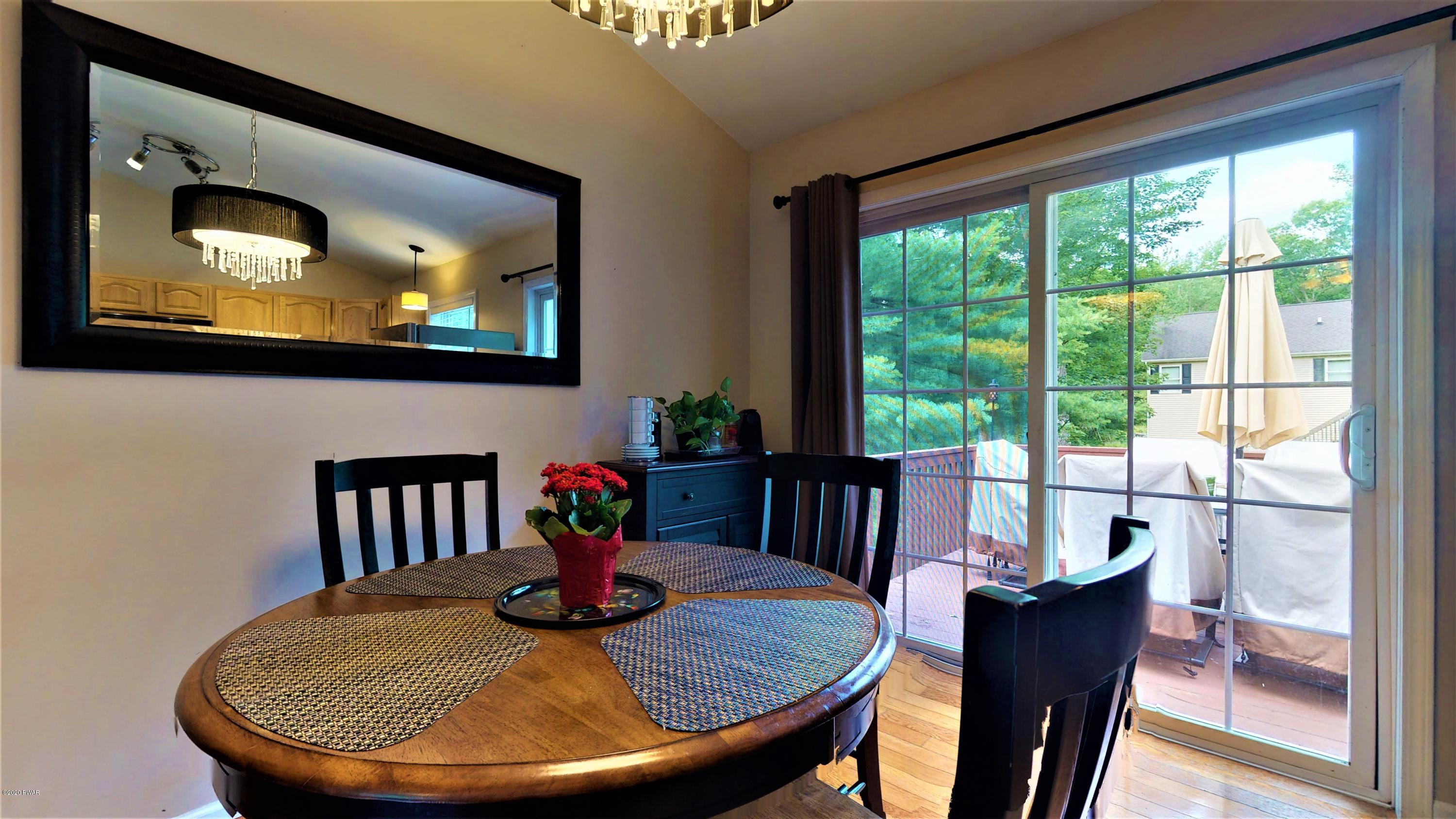 143 Raccoon Road Dingmans Ferry, PA 18328 - Photo 47 of 87 a view of a dining room with furniture window and outside view