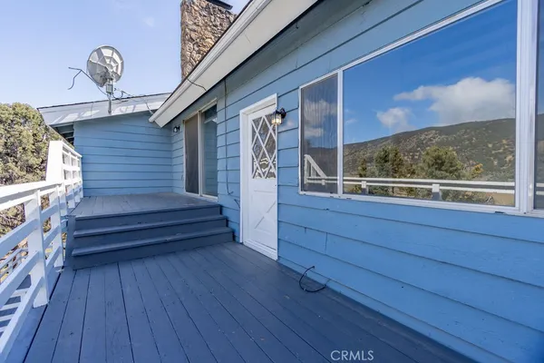 a view of balcony with wooden floor