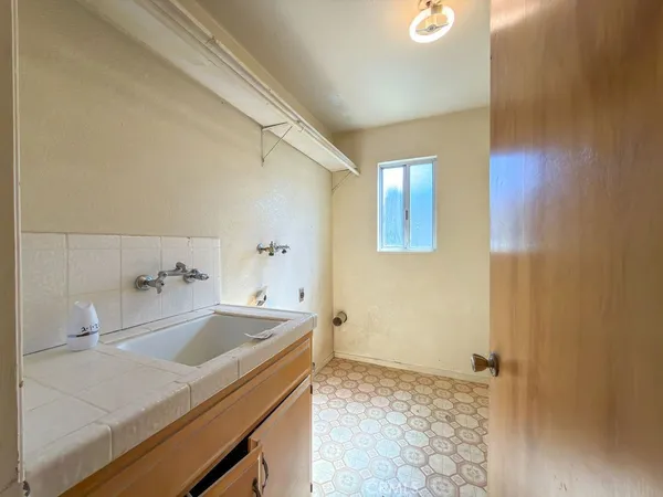 a empty room with wooden floor and doors