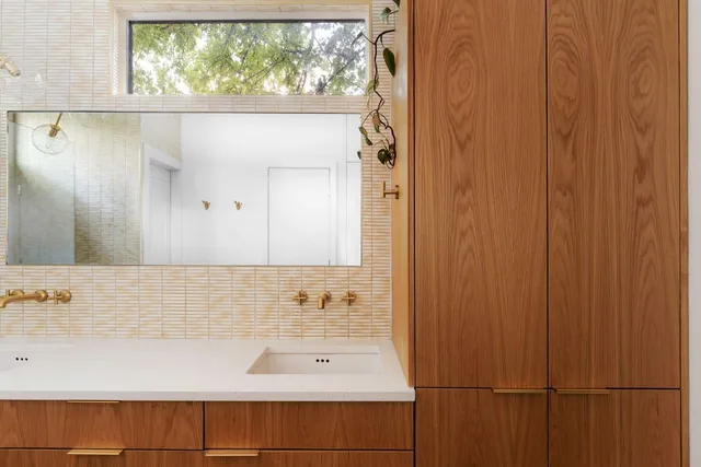 a bathroom with a bathtub and shower