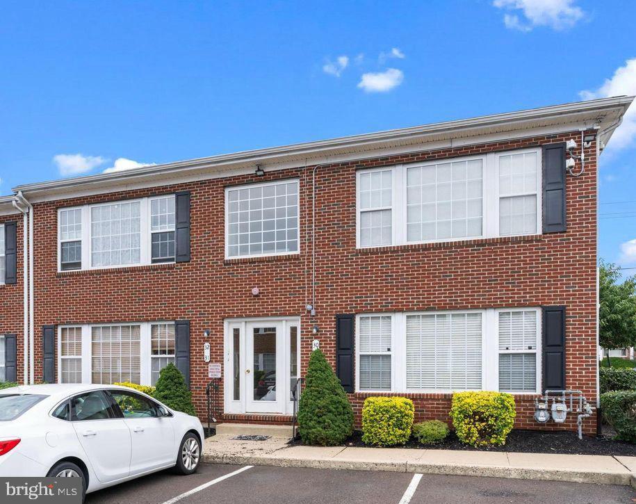 9228 Blue Grass Road, Unit 30 Philadelphia, PA 19114 - Photo 2 of 11 Charming brick facade with modern appeal.
