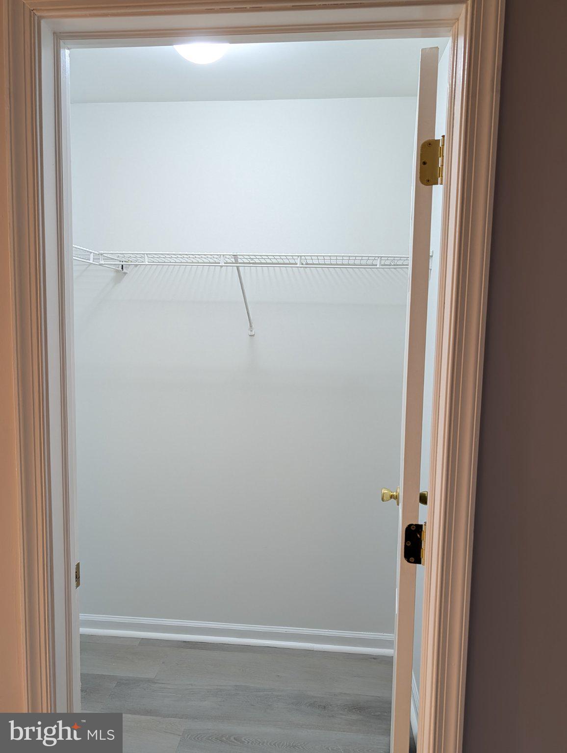 9228 Blue Grass Road, Unit 30 Philadelphia, PA 19114 - Photo 10 of 11 Spacious closet with modern design.