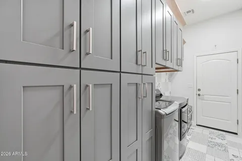 a view of a storage & utility room with racks on the wall