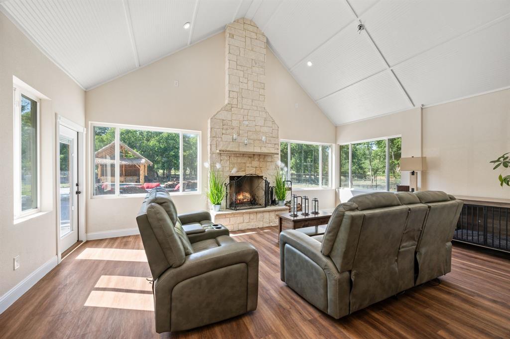 1216 W Road Waxahachie, TX 75165 - Photo 21 of 40 a living room with furniture and a fireplace