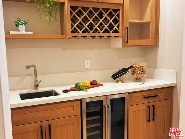 a kitchen with a sink and cabinets
