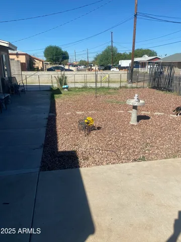 a view of a swimming pool with a yard