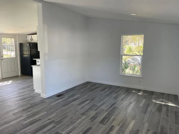 a bathroom with a sink toilet and a window