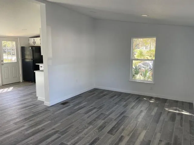 a bathroom with a sink toilet and a window