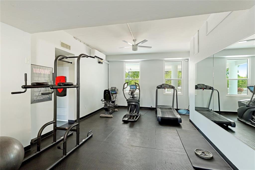 33 South Gulfstream Avenue, Unit 307 Sarasota, FL 34236 - Photo 14 of 34 a view of a room with gym equipment