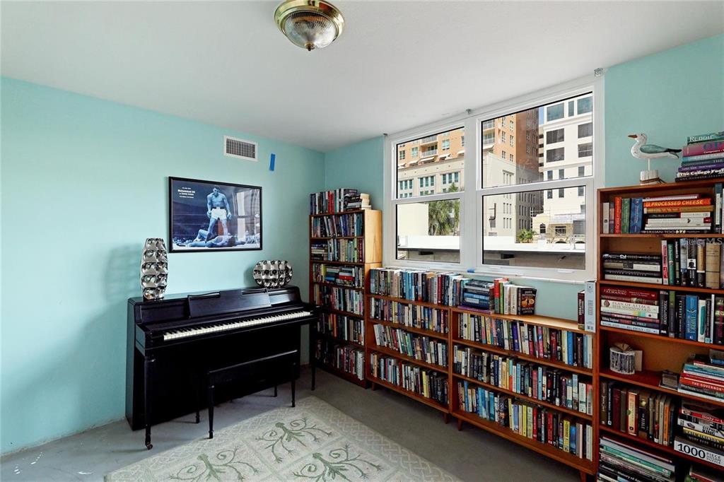 33 South Gulfstream Avenue, Unit 307 Sarasota, FL 34236 - Photo 16 of 34 a room with furniture and book shelf