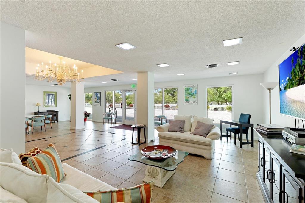 33 South Gulfstream Avenue, Unit 307 Sarasota, FL 34236 - Photo 18 of 34 a living room with furniture and wooden floor