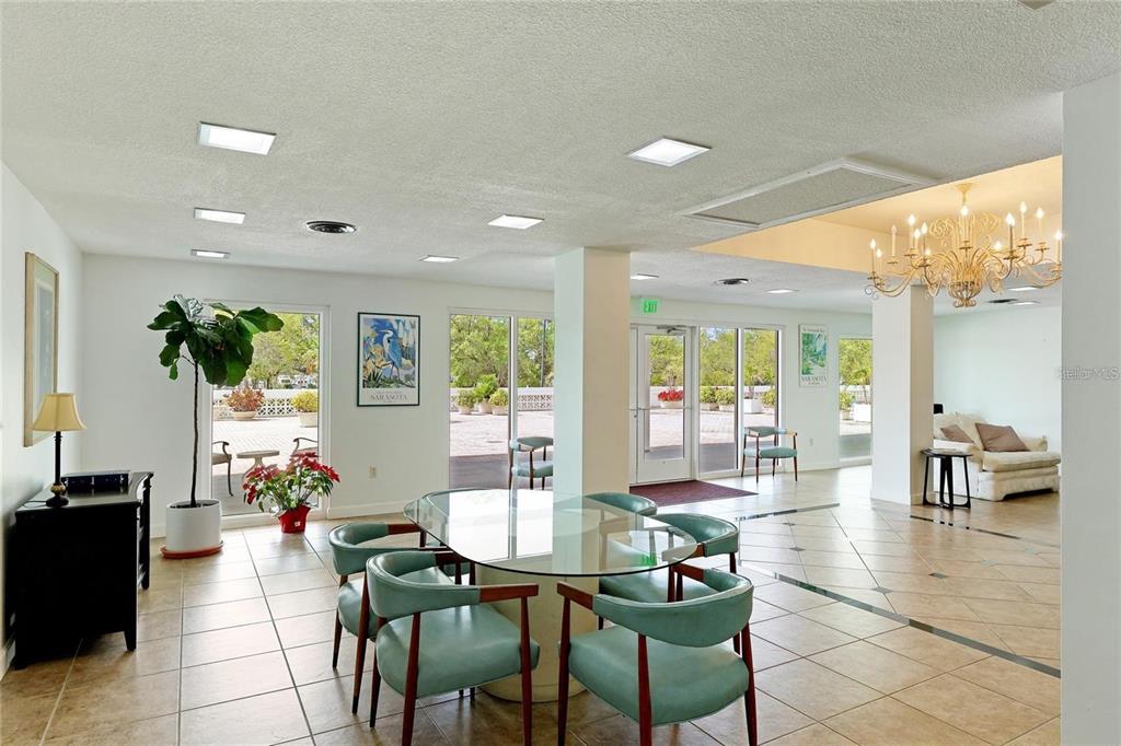 33 South Gulfstream Avenue, Unit 307 Sarasota, FL 34236 - Photo 19 of 34 a view of a dining room with furniture window and outside view
