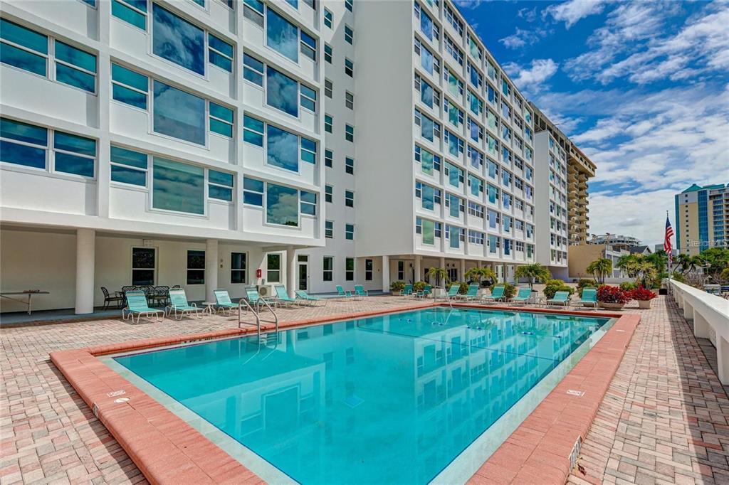 33 South Gulfstream Avenue, Unit 307 Sarasota, FL 34236 - Photo 27 of 34 a view of an buildings with swimming pool