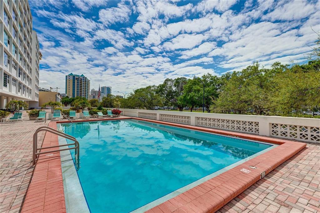 33 South Gulfstream Avenue, Unit 307 Sarasota, FL 34236 - Photo 28 of 34 a view of swimming pool with a yard
