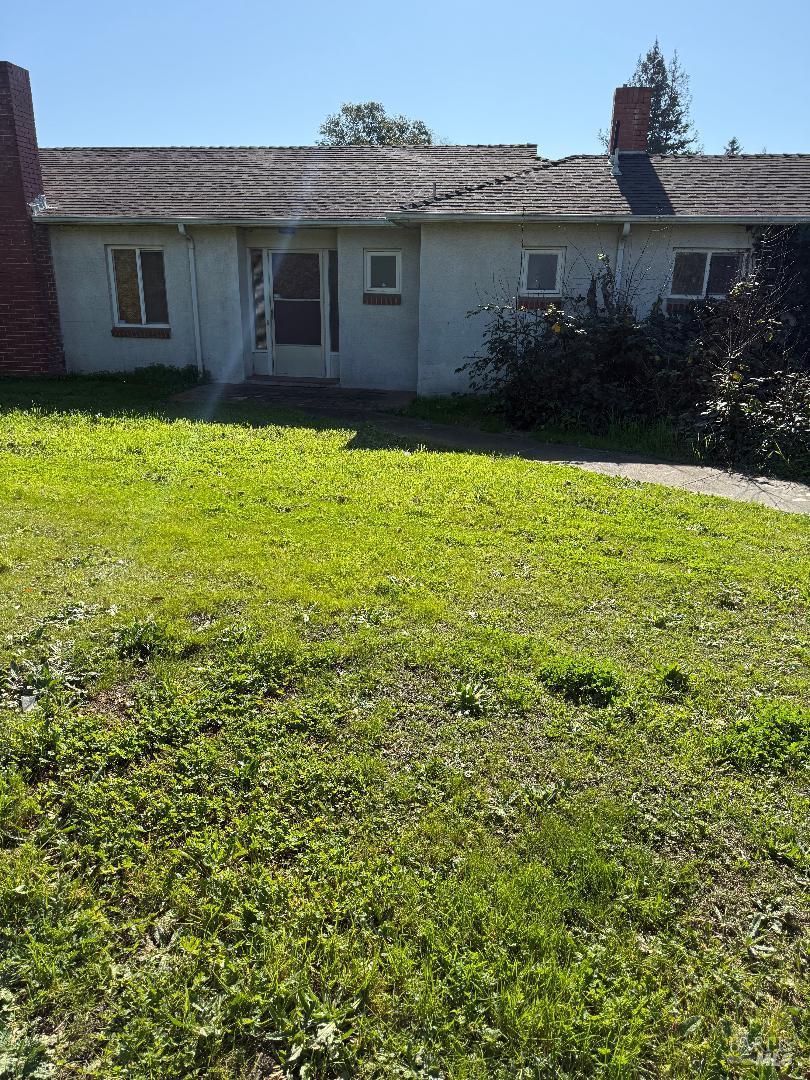 a view of a yard in front of a house