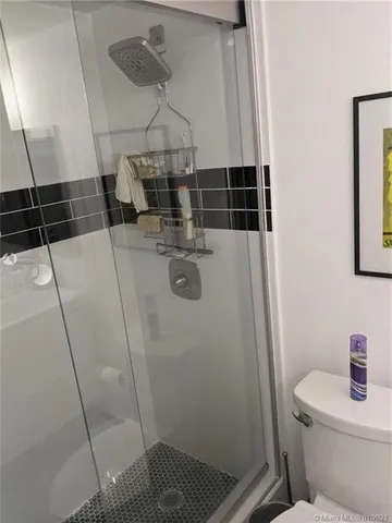 a bathroom with a sink and toilet