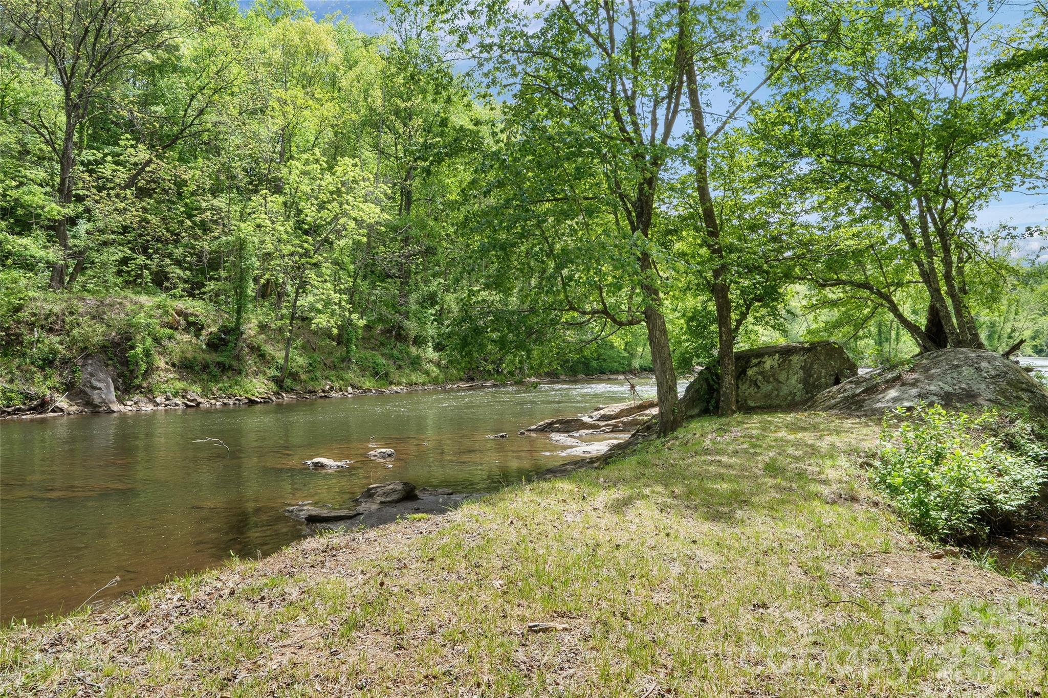 788 Cowee Tunl Road Sylva, NC 28779 - Photo 1 of 31 a view of a lake view with a large tree