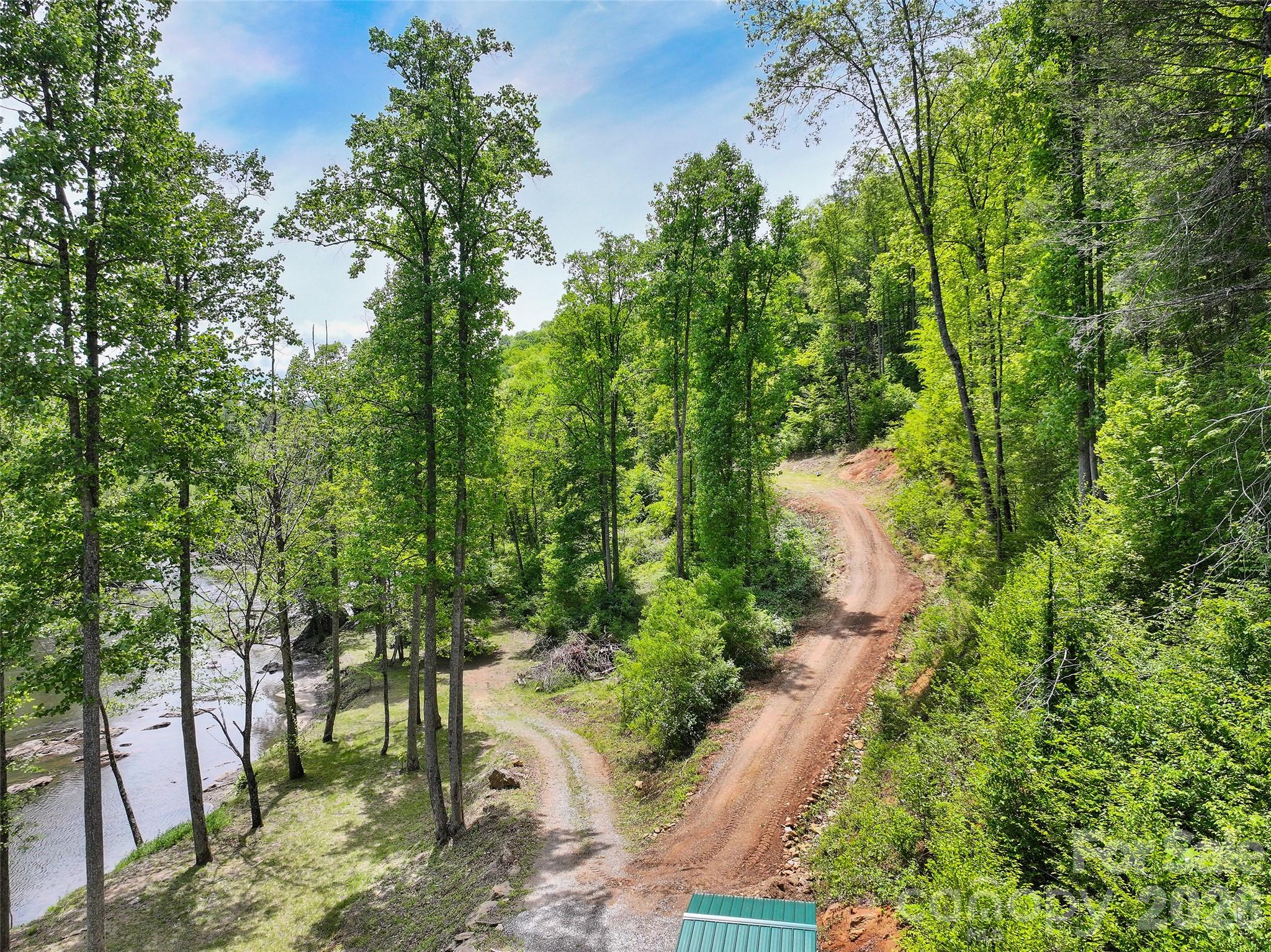 788 Cowee Tunl Road Sylva, NC 28779 - Photo 12 of 31 a backyard of a house with lots of green space