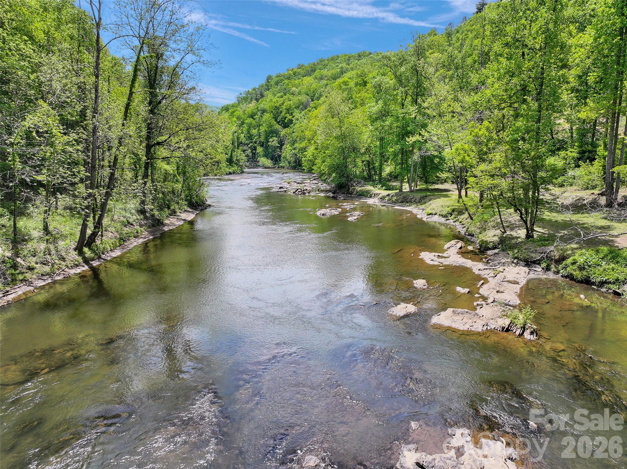 788 Cowee Tunl Road Sylva, NC 28779 - Photo 21 of 31 a view of a lake view with a garden