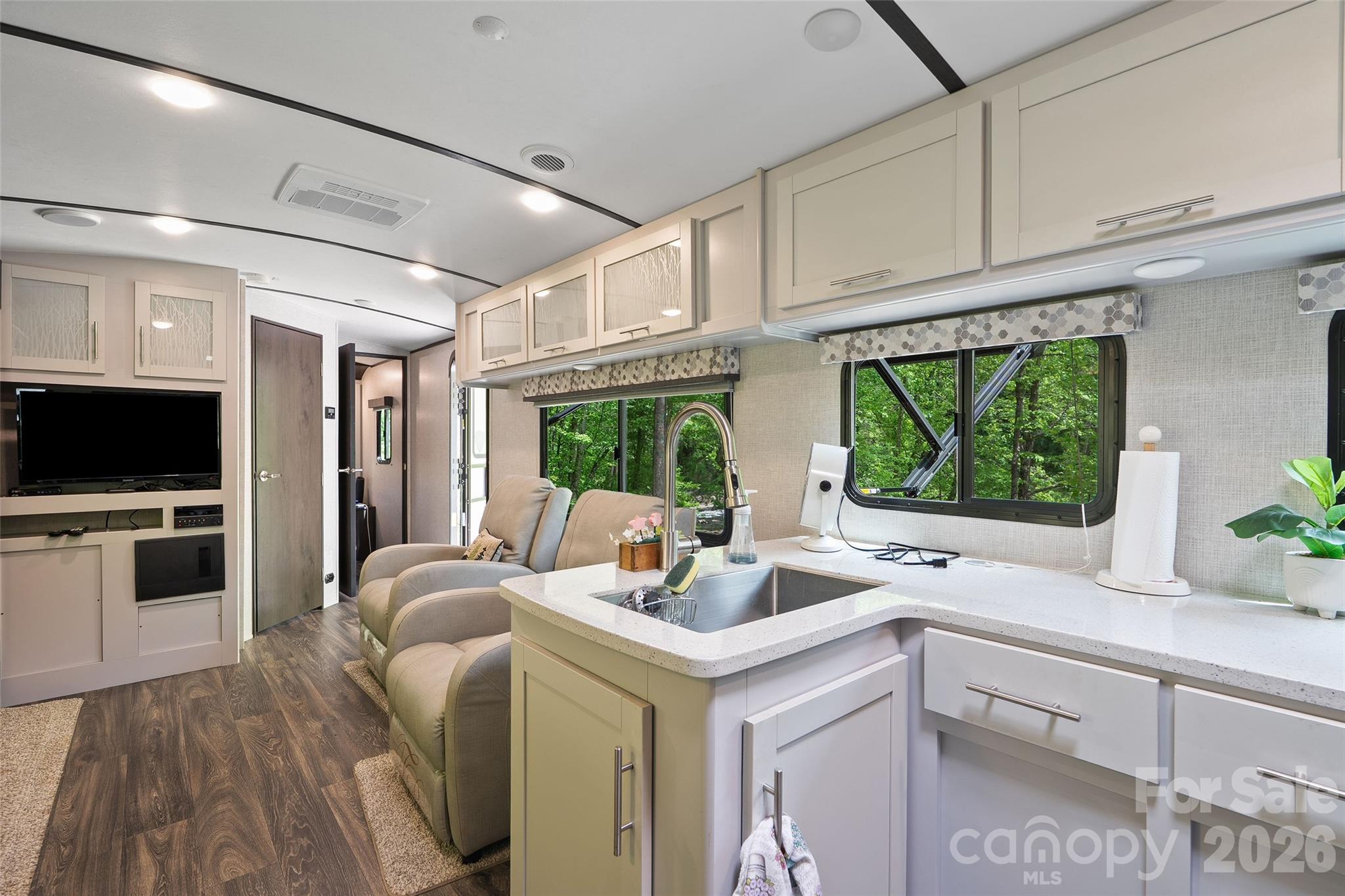 788 Cowee Tunl Road Sylva, NC 28779 - Photo 26 of 31 a kitchen with a sink appliances and cabinets