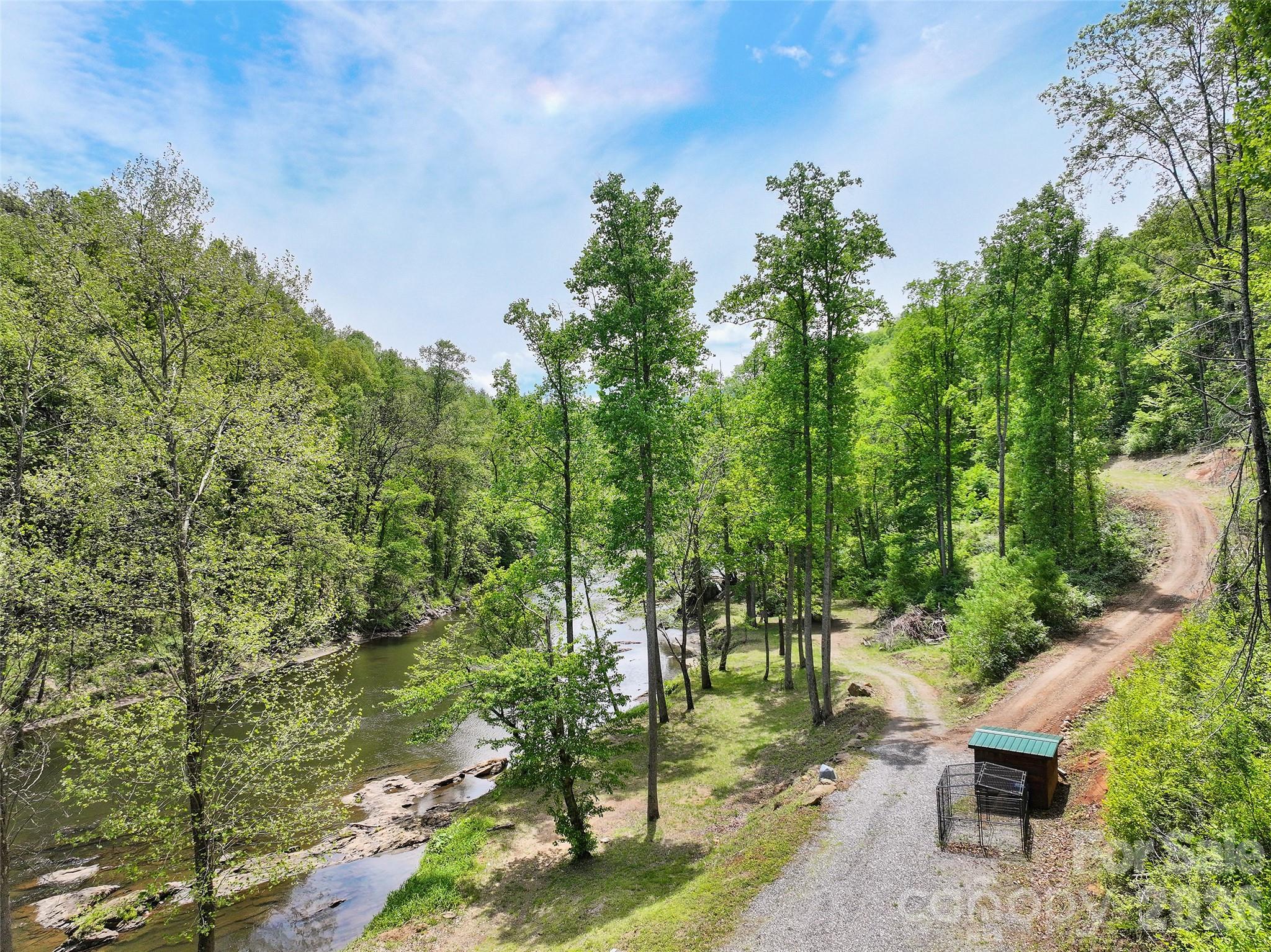 788 Cowee Tunl Road Sylva, NC 28779 - Photo 5 of 31 a backyard of a house with table and chairs