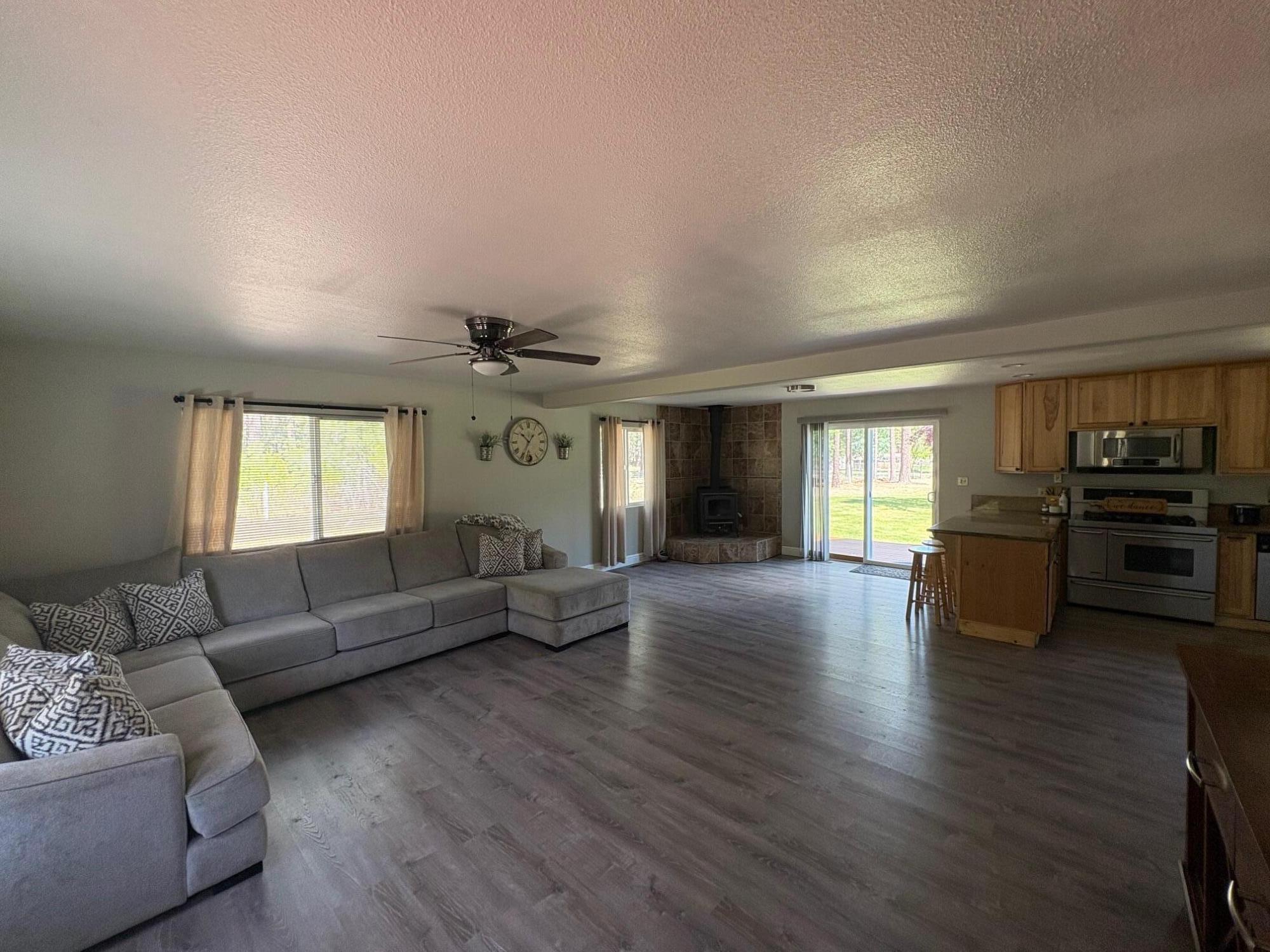 40596 Old School Road Fall River Mills, CA 96028 - Photo 11 of 29 a living room with furniture and a large window