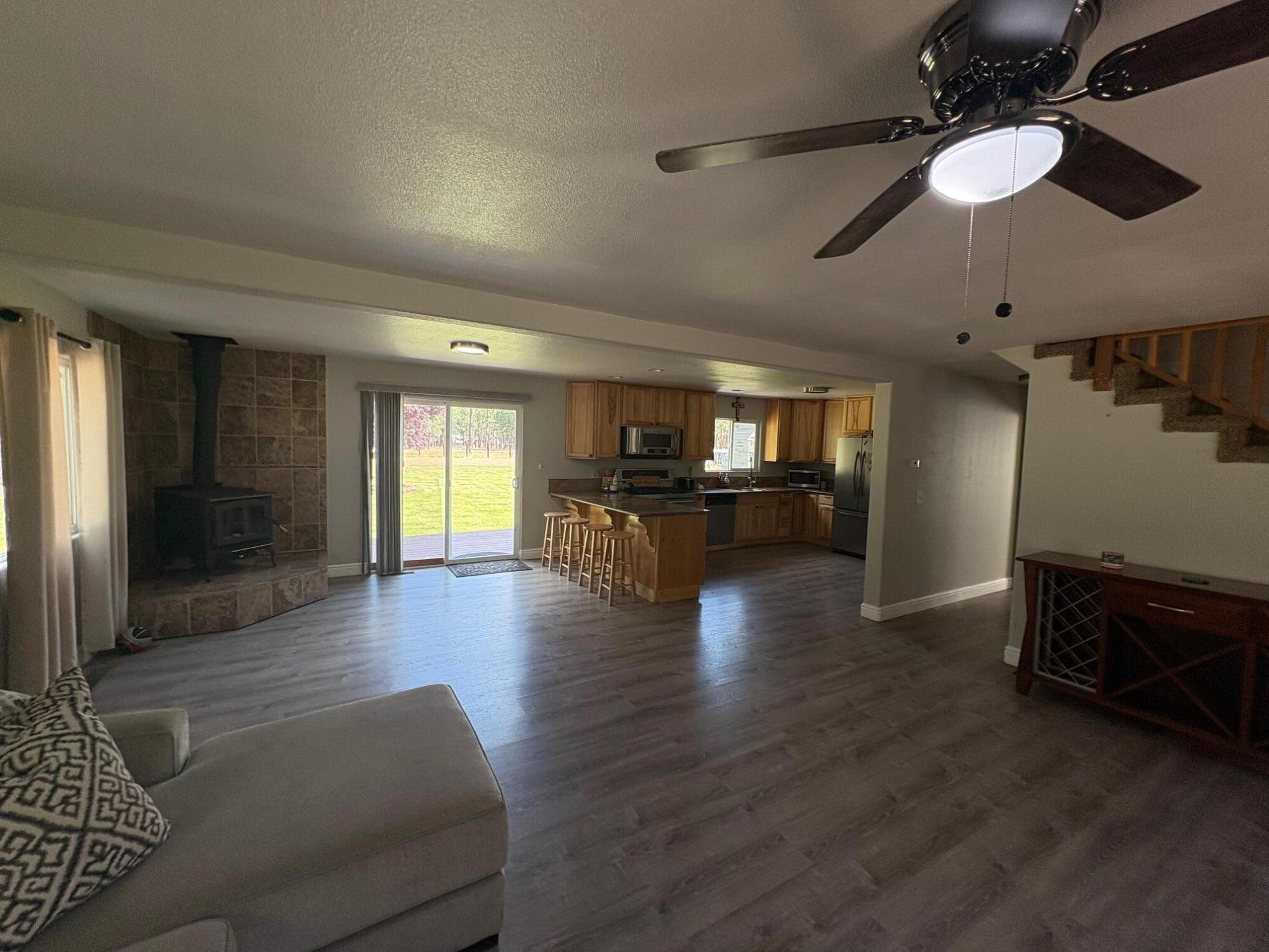 40596 Old School Road Fall River Mills, CA 96028 - Photo 12 of 29 a view of kitchen with furniture and wooden floor