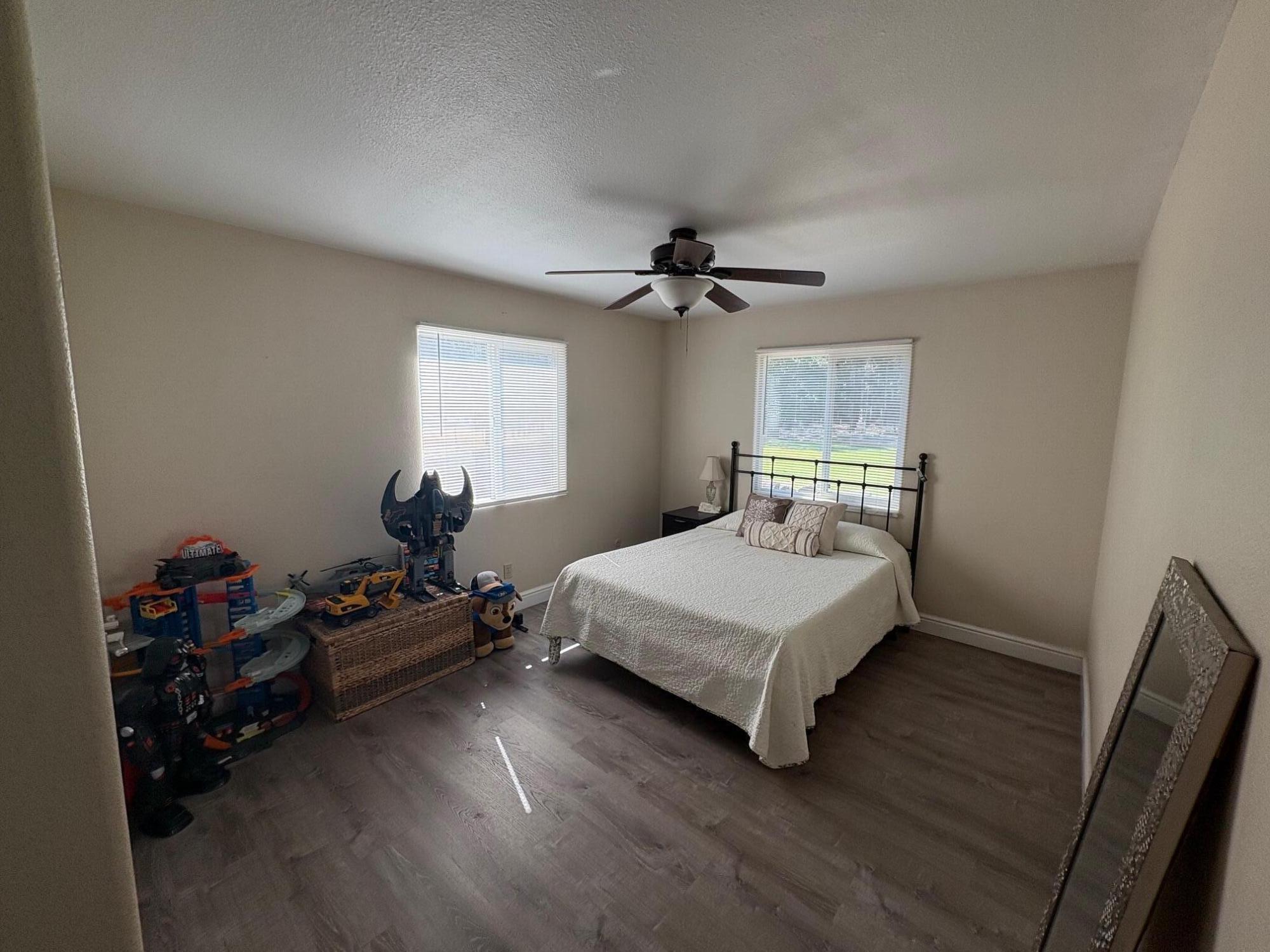 40596 Old School Road Fall River Mills, CA 96028 - Photo 16 of 29 a bedroom with a bed and a window