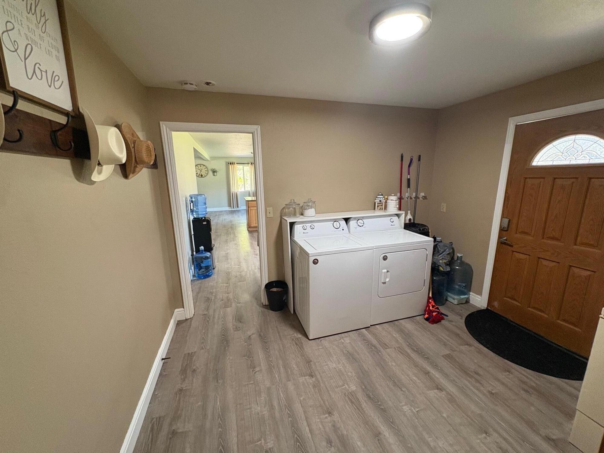 40596 Old School Road Fall River Mills, CA 96028 - Photo 20 of 29 a utility room with wooden floor washer and dryer