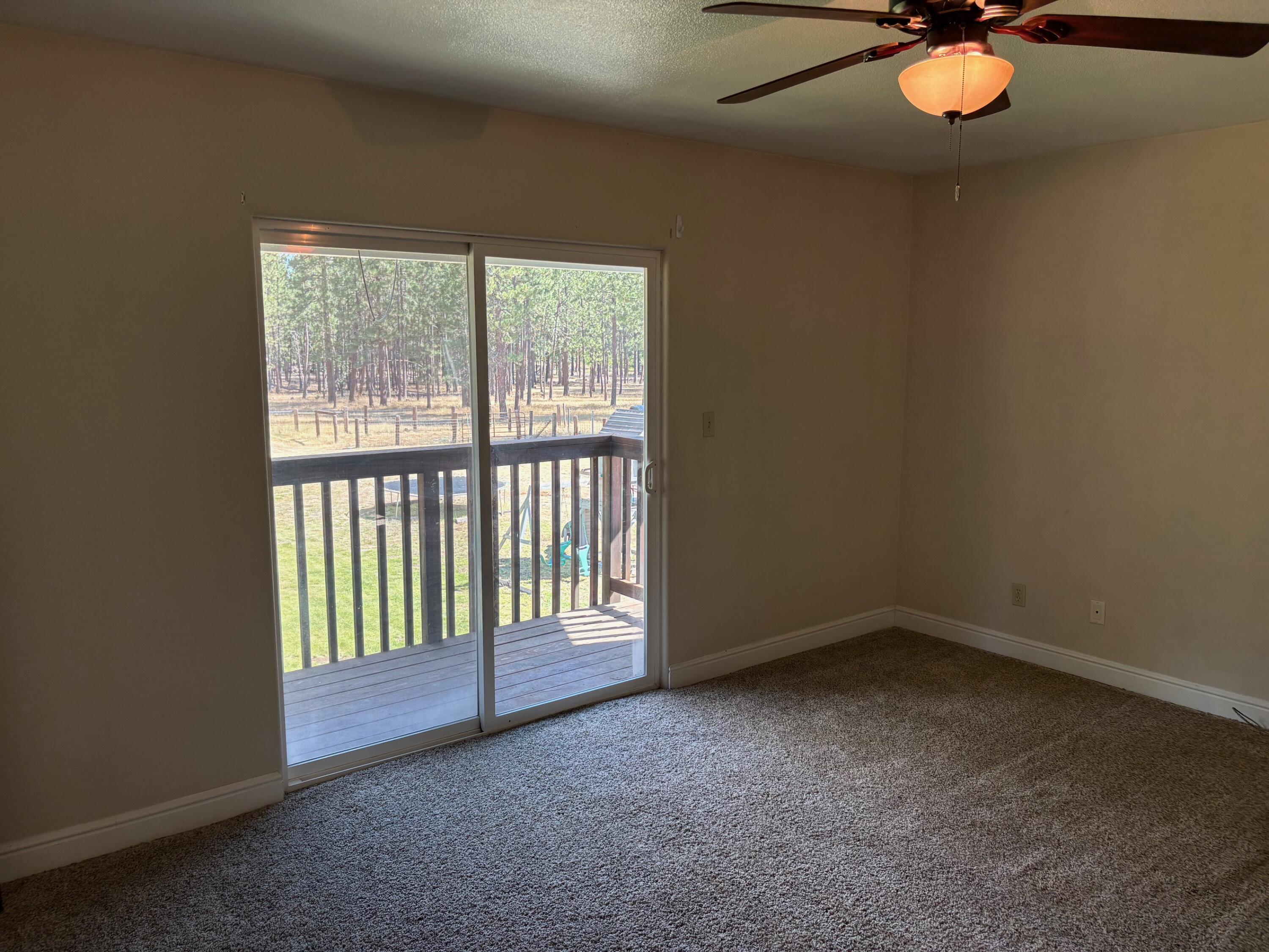 40596 Old School Road Fall River Mills, CA 96028 - Photo 24 of 29 a view of an empty room with a window