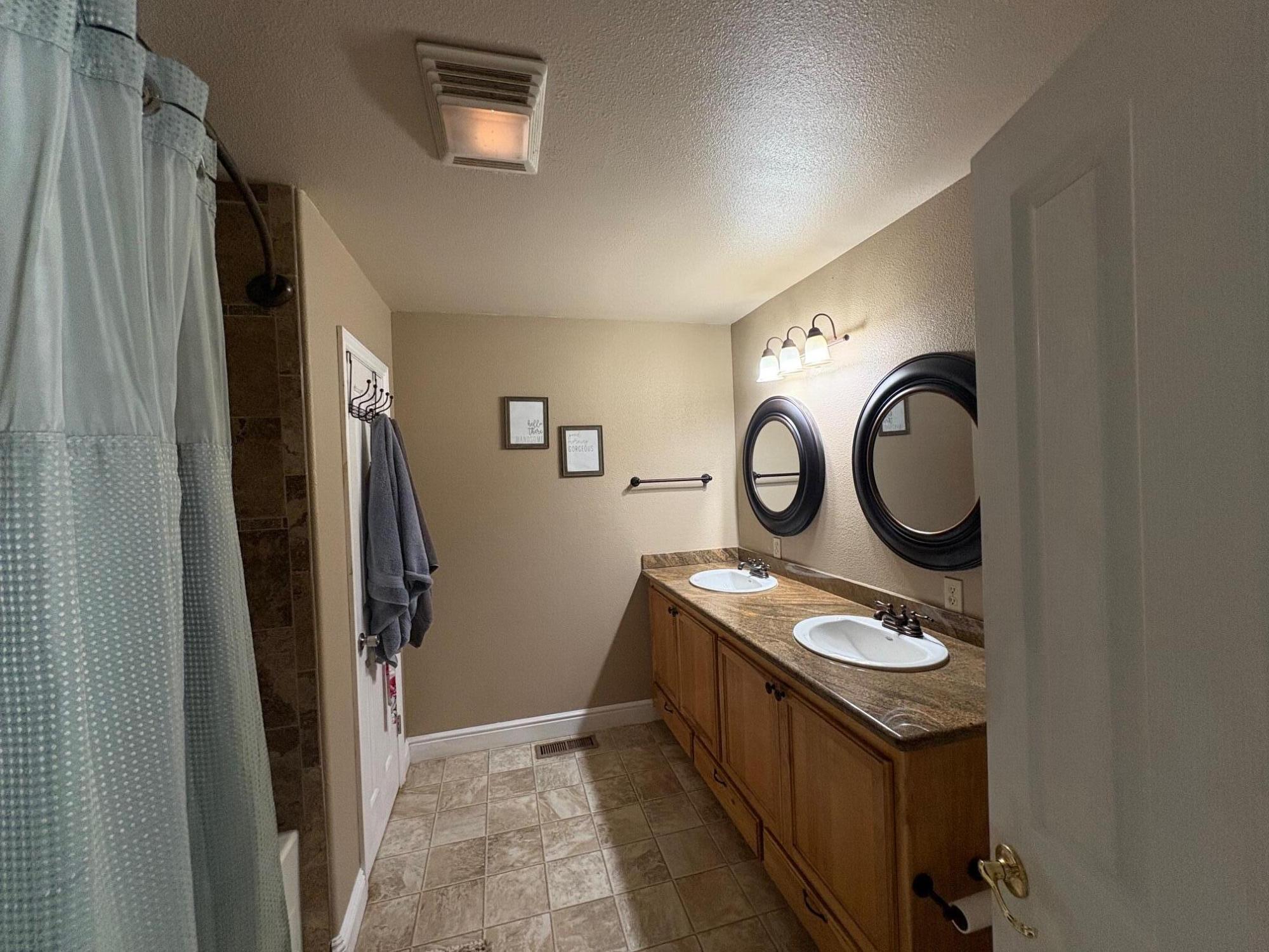 40596 Old School Road Fall River Mills, CA 96028 - Photo 29 of 29 a bathroom with a toilet a sink and a mirror