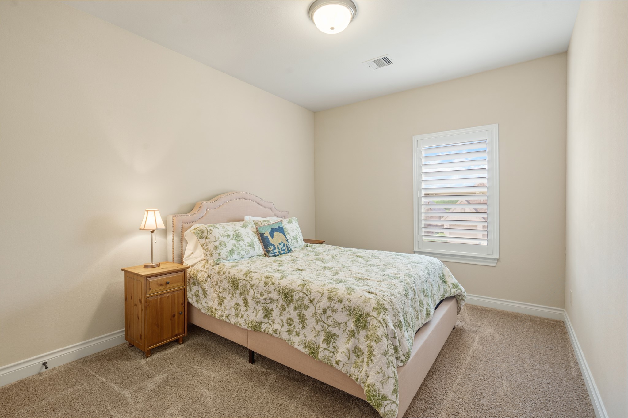 1607 Quail Ridge Drive Katy, TX 77493 - Photo 24 of 33 The first of two large secondary bedrooms upstairs, which could be perfect for anyone in the family, with plenty of closet space, plush carpet and it's located next to the upstairs secondary bathroom.