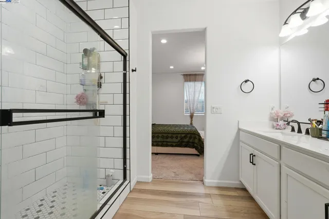 a bathroom with a shower and a sink