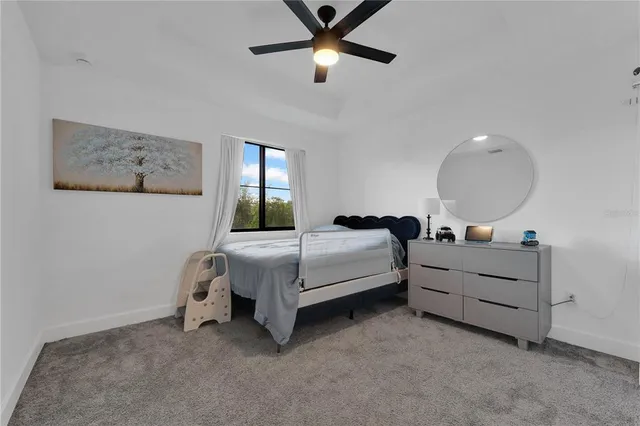 a bedroom with bed and window