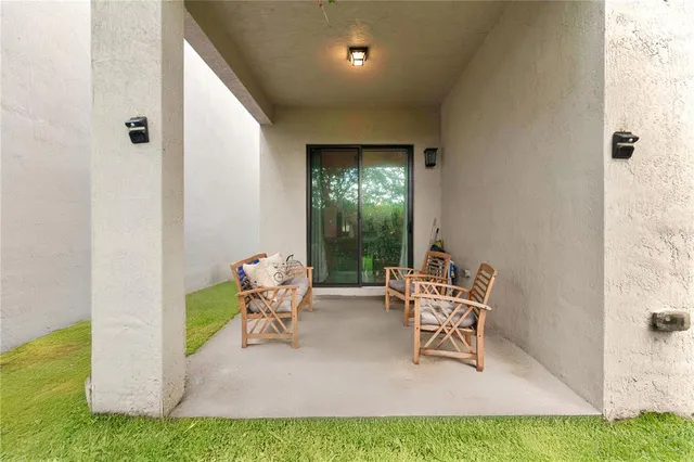 a dining room with furniture and a window