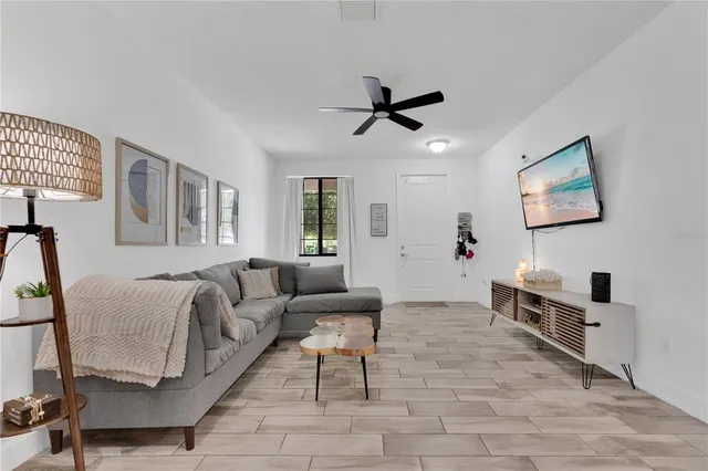 a living room with furniture and a window