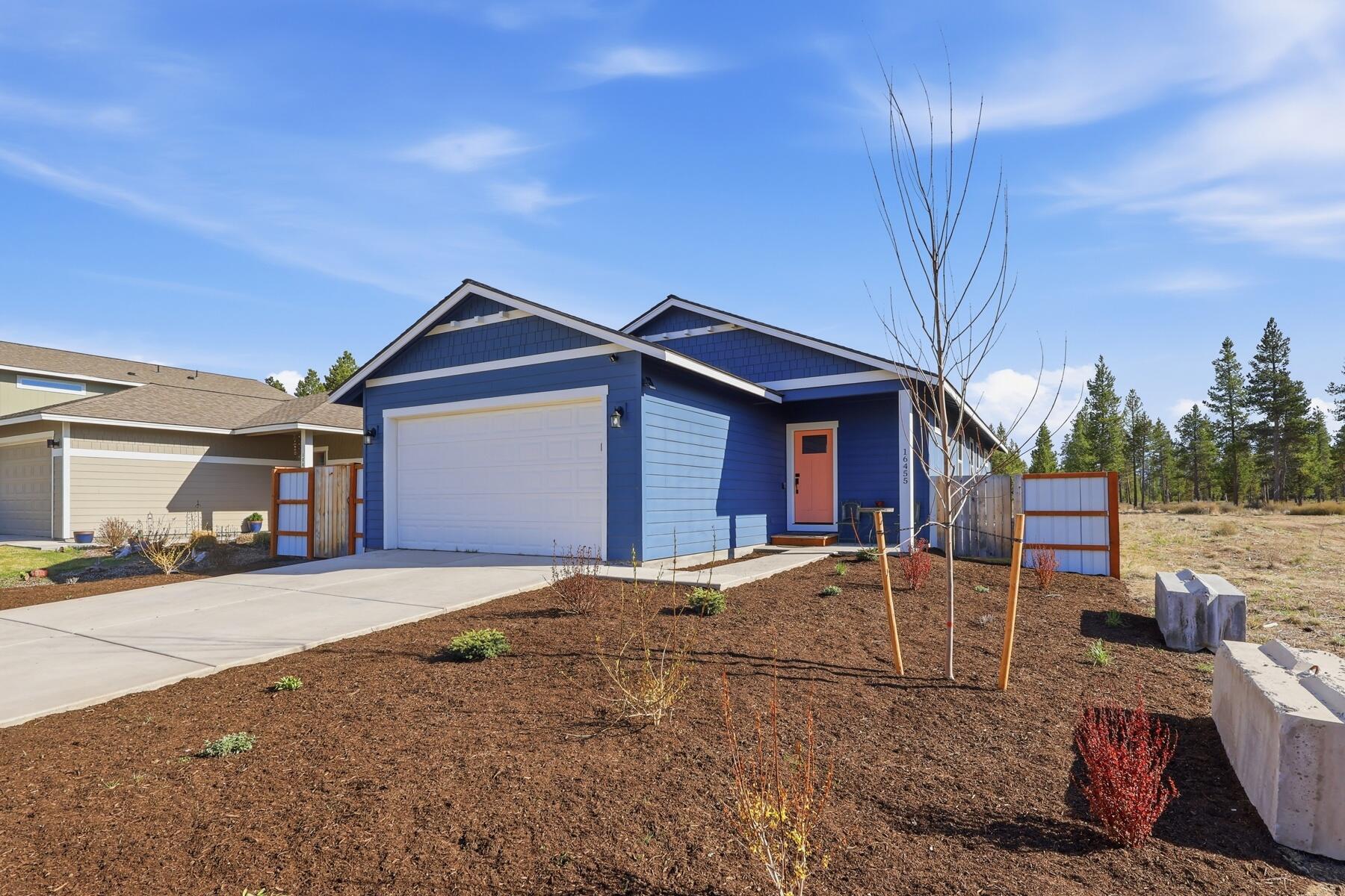 16455 Bassett Road La Pine, OR 97739 - Photo 42 of 44 a front view of a house with a yard and garage