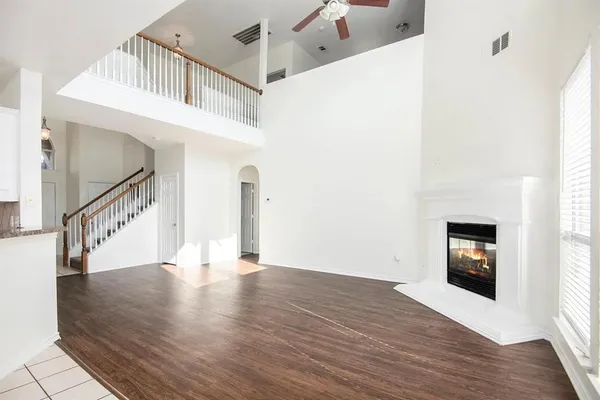 a view of an entryway with wooden floor