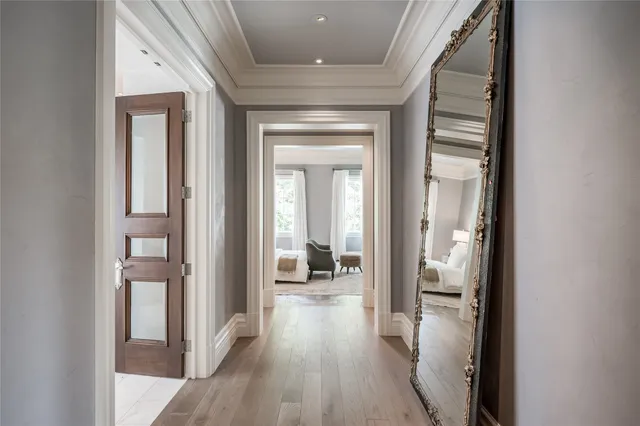 a view of a hallway view with wooden floor and staircase