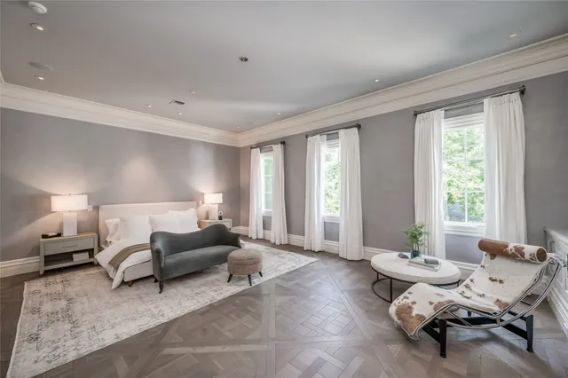 a living room with furniture and large windows