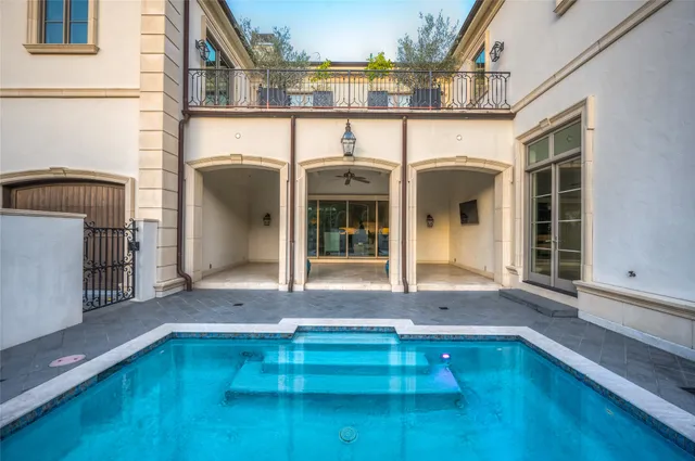 a front view of a house with swimming pool