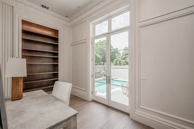 a view of room with wooden floor and windows