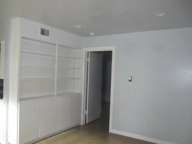 a view of an empty walk in closet