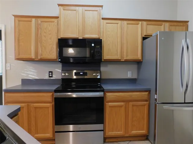 a kitchen with a stove and a microwave