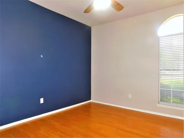 an empty room with a empty space and a window