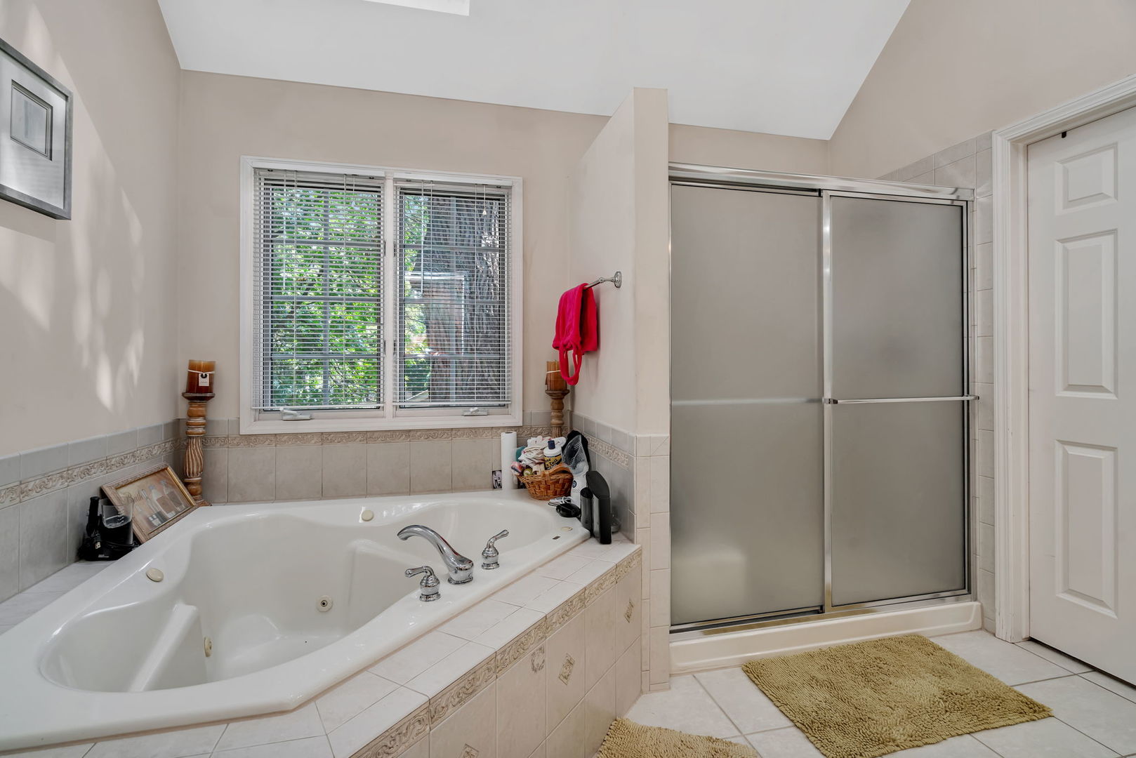 745 Feather Sound Drive Bolingbrook, IL 60440 - Photo 24 of 38 a bathroom with a tub a sink and a window