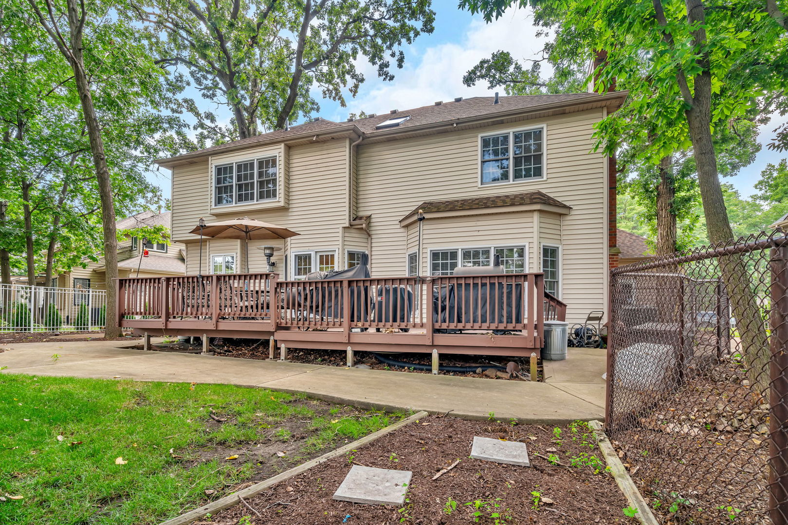 745 Feather Sound Drive Bolingbrook, IL 60440 - Photo 35 of 38 a view of a house with wooden deck and furniture